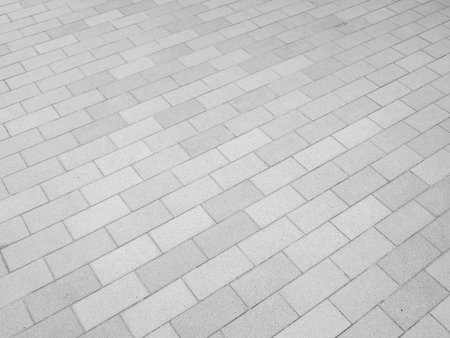 Old gray pavement tiles backgroundの写真素材