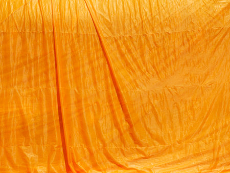 crumpled yellow monk robe. Backgroundの写真素材