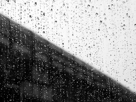 Water and rain drops on the glass, abstract view