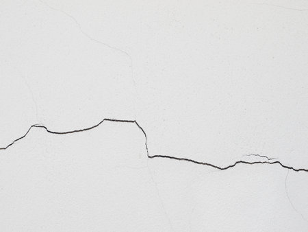 cracked wall white background textureの写真素材