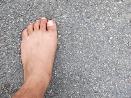 man leg on asphalt roadの写真素材