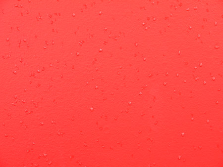 red wall with water dropの写真素材