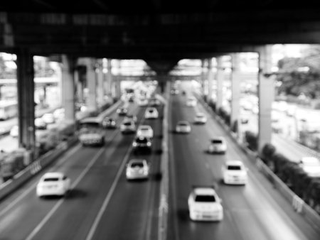Blur cityscape with car people and road black and white versionの写真素材
