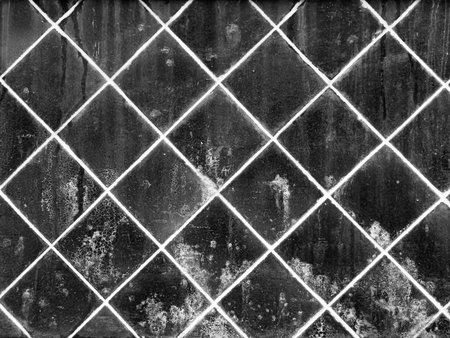 grunge old black ceramic wall tiles backgroundの写真素材