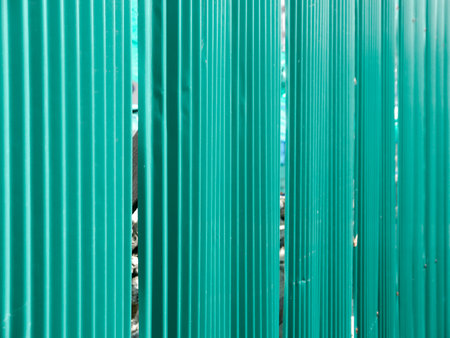 green color corrugated metal sheet as backgroundの写真素材