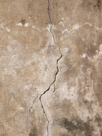 Grunge concrete cement wall with crack in industrial building, great for your design and texture...