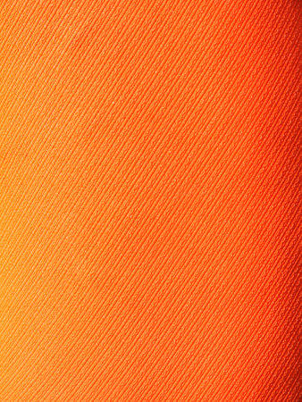 orange striped fabric as backgroundの写真素材