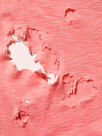 pink fabric torn textureの写真素材