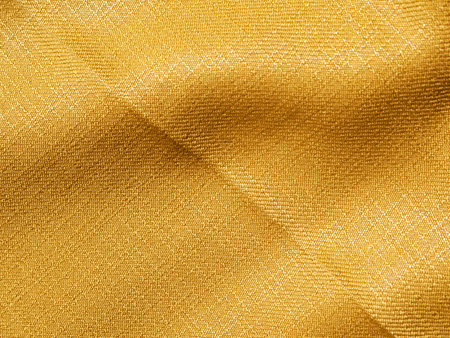 Gold thread on the fabricの写真素材