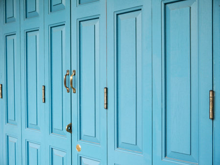Old Door handles with an old double door painted with blueの写真素材