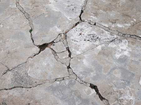 Cracked concrete texture closeup backgroundの写真素材