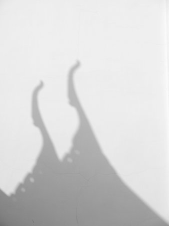 Roof shadow on a white wall