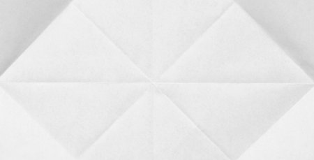 White sheet of paper folded textureの写真素材