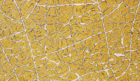 Texture of cracked yellow backgroundの写真素材