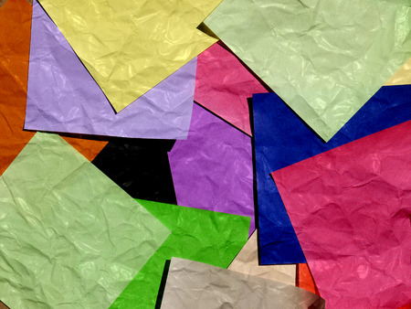Stack of paper on multicolor backgroundの写真素材