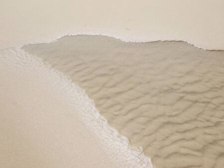 sand beach wave with waterの写真素材