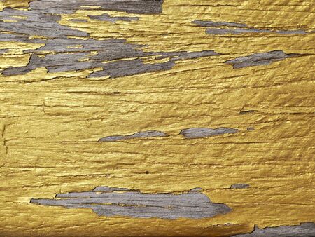gold paint on wooden panelの写真素材