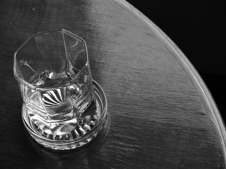 black and white glass on wood tableの写真素材