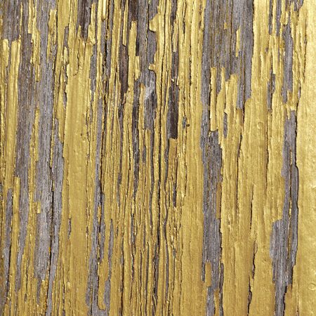 gold paint on wooden panelの写真素材