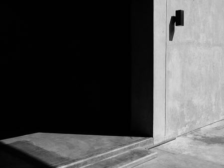 Vintage interior of stone wall and gray cement floor with shadow and lightの写真素材