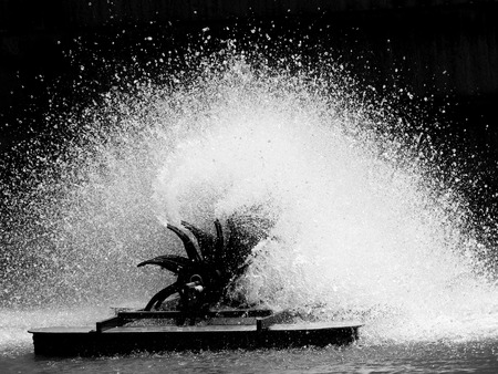 Aerator turbine wheel fill oxygen into water in lakeの写真素材