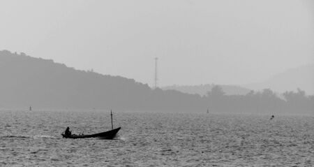Fishing boat silhouette in black and whiteの写真素材