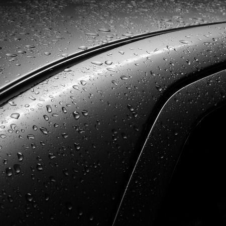 drops of water on the car after rainの写真素材