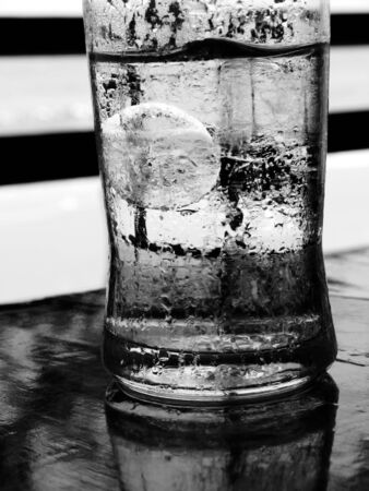 black and white Ice in water glassの写真素材
