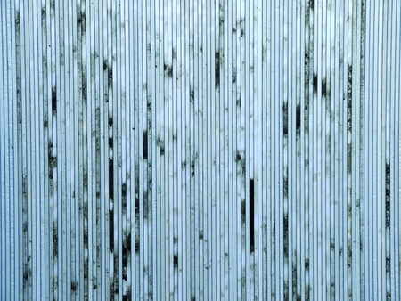 dirty old blue polycarbonate sheet patternの写真素材