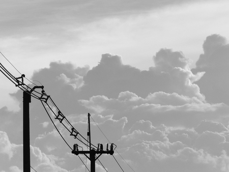 Silhouette shot electricity silhouetted against, Black and white tonesの写真素材