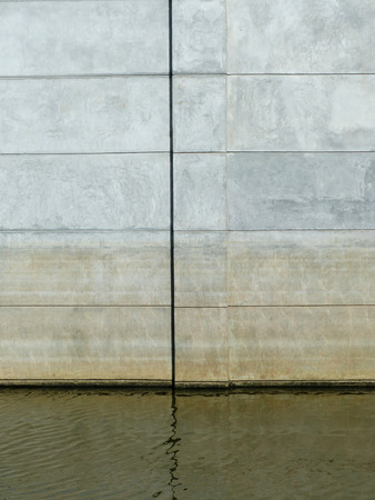 dirty wall with water reflectionの写真素材