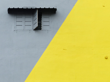 gray and yellow paint color wall backgroundの写真素材