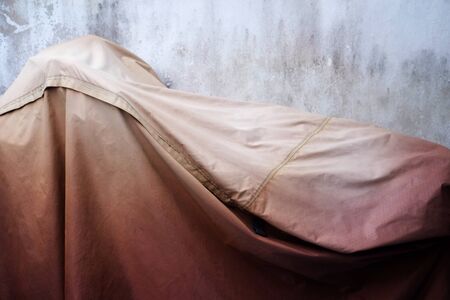 bicycle cover canvas and dirty wallの写真素材