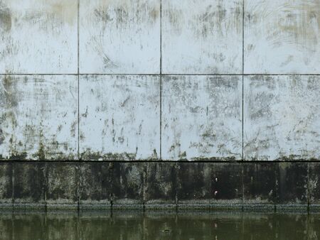 dirty wall with water reflectionの写真素材