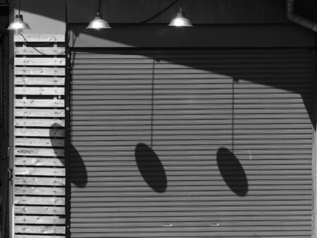 metallic roller shutter door with shadowの写真素材