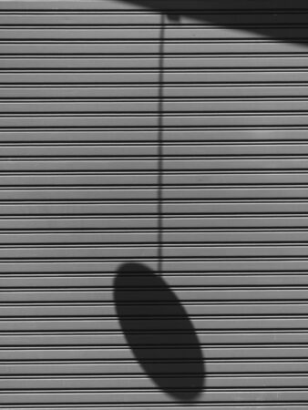 metallic roller shutter door with shadowの写真素材