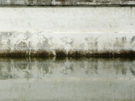 dirty wall with water reflectionの写真素材