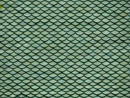 Clay roof tiles of Thai temple. Close upの写真素材