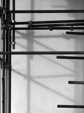 Scaffolding on renovating house under construction - in black and whiteの写真素材