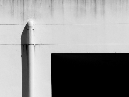 white home wall with shadowの写真素材