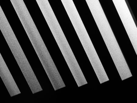 black and white interior aluminium ceiling with light and shadowの写真素材