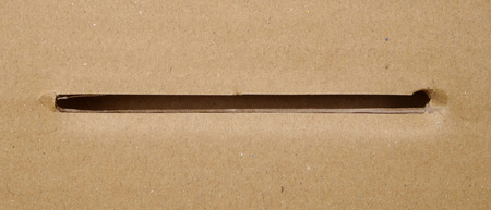 Brown paper box with a hole
