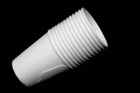 white paper cup on black backgroundの写真素材