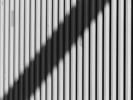black and white architecture metal wall design with light and shadow