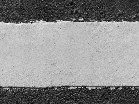 closeup new white line on the road textureの写真素材