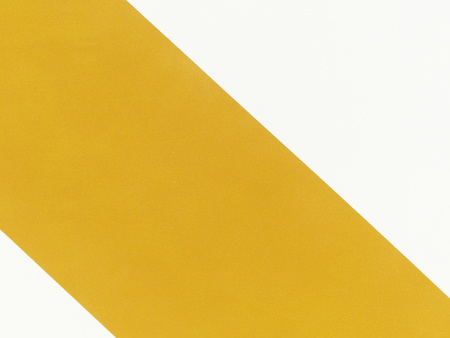 Gold paper texture on white wall backgroundの写真素材