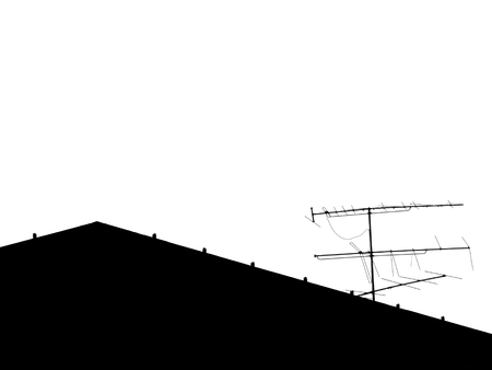 Silhouette roof with TV antennaの写真素材