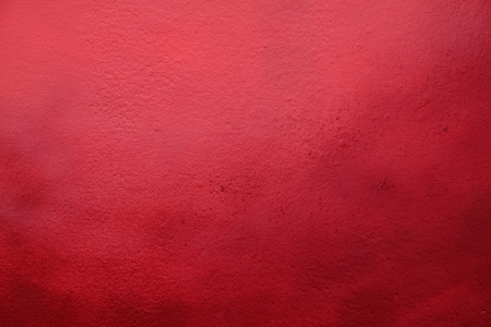red paint wall backgroundの写真素材