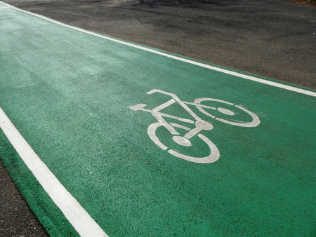 Bicycle path sign on the asphalt roadの写真素材