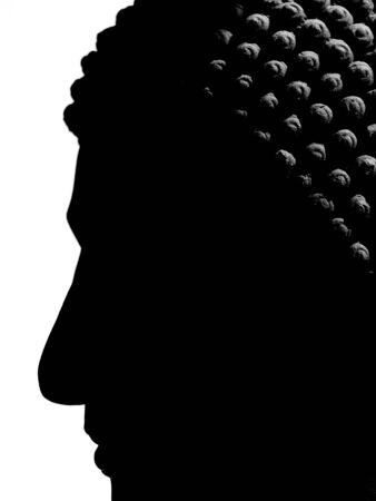 Buddha face statue silhouette closeupの写真素材